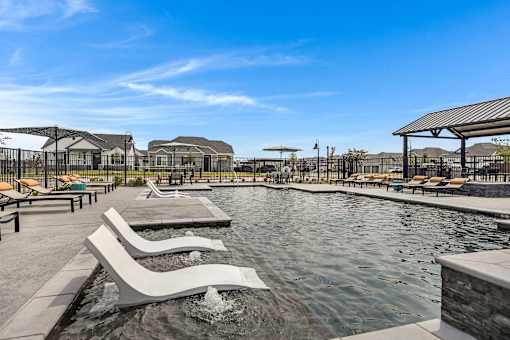 Resort-style pool and lounging at Avilla Oakridge in Forney, TX.