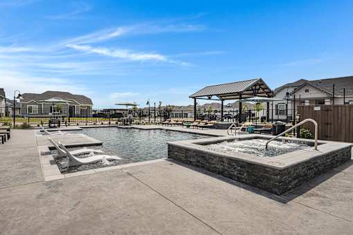 Resort-style pool, spa, and lounging at Avilla Oakridge in Forney, TX.
