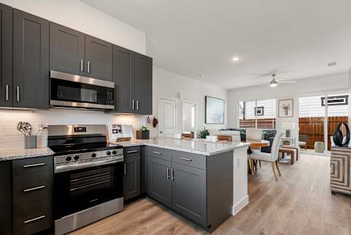 Gourmet Kitchen with Island at Avilla Rio Oaks Apartments, Liberty Hill, TX 78642