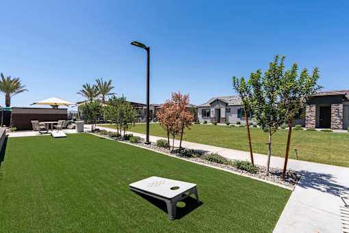 Outdoor Green Space + Game Area at Avilla Marigold, Buckeye, AZ 85396