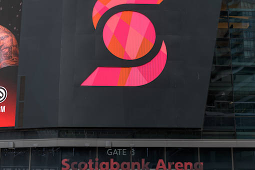 A large pink and orange logo on a black background with the words "Scotiabank Arena" written below it.