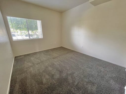 Carpeted Bedroom at Sharlands Terrace Apartments, Reno, NV