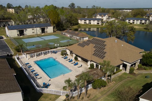 an aerial view of the pool and tennis court at the resort at Stoneridge Apartments, Florida, 32608