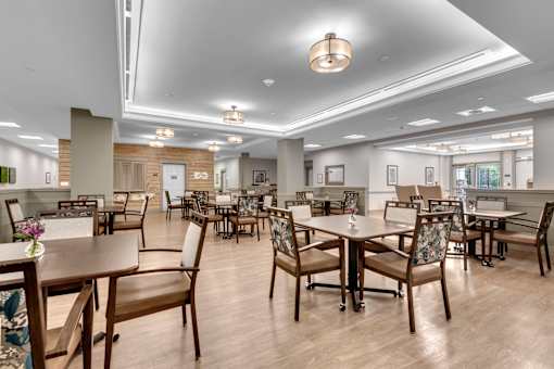 A large room with tables and chairs.