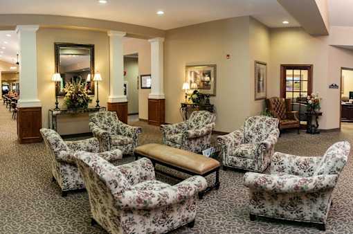 A room with floral chairs at Hearthside Collierville, Collierville, TN.