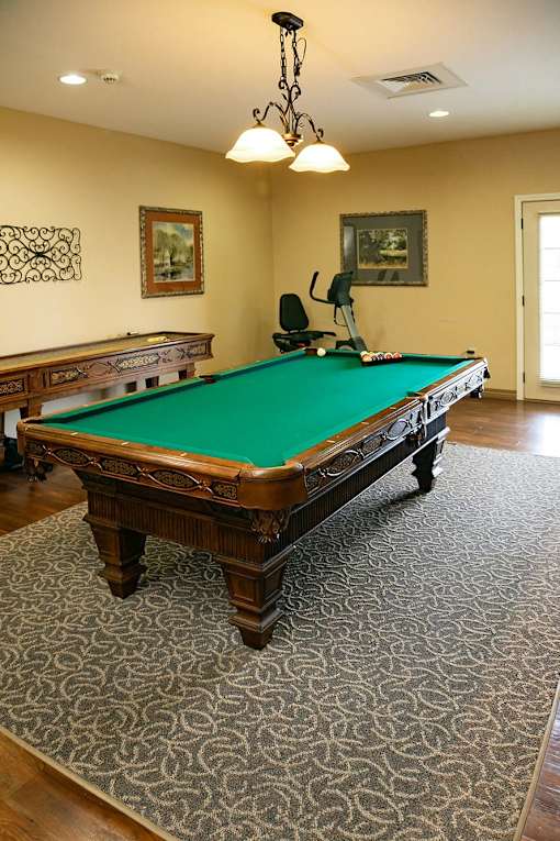 A pool table in a room at Hearthside Collierville, Collierville, TN.