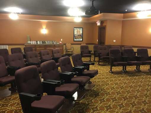 Theatre with rows of brown seats in a room at The Shores of Lake Phalen, Maplewood, MN.