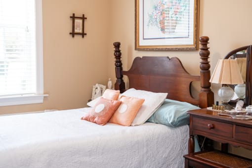 Bedroom with a bed Spring Arbor of Cary