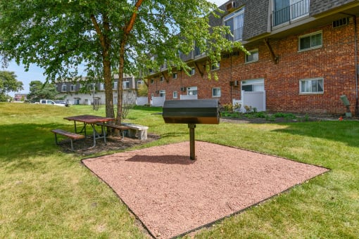 Outdoor grill station and picnic area at Fox Run Apartments, St. Charles, 60174