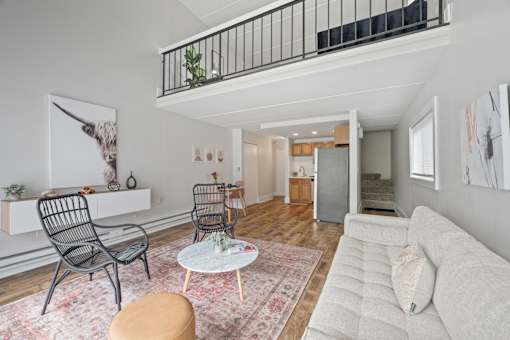 Modern loft apartment with stylish furnishings and balcony at Fox Run Apartments, Illinois