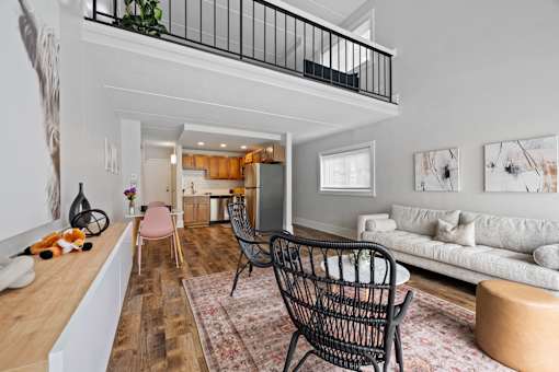 Two story living room with kitchen and loft at Fox Run Apartments, Illinois, 60174