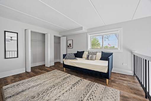 Upstairs loft with closets and daybed at Fox Run Apartments, Illinois