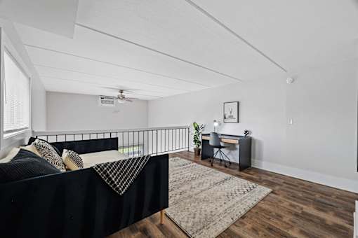 Upstairs loft area with black metal railing at Fox Run Apartments, St. Charles, IL 60174