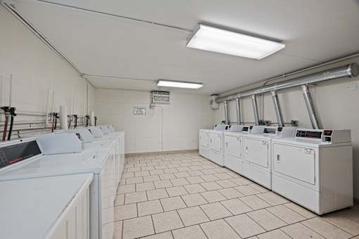 Communal laundry room with washers and dryers at Fox Run Apartments, St. Charles, 60174