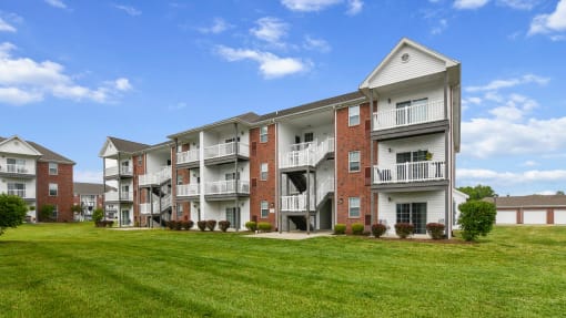 Exterior view of building with private balconies and patios at The Reserves of Thomas Glen, Shepherdsville, KY, 40165