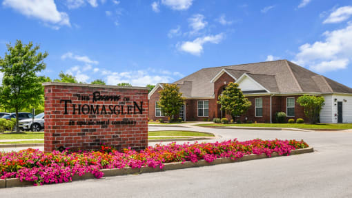 Welcoming entrance sign with view of clubhouse leasing office at The Reserves of Thomas Glen, Shepherdsville, KY, 40165