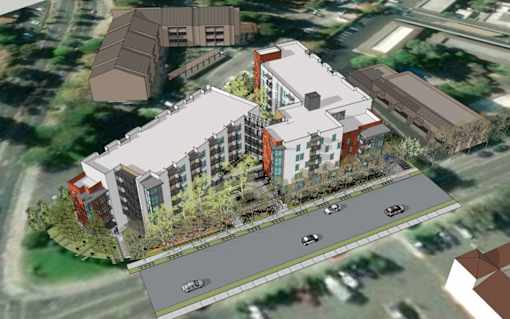 A rendering of a modern building with a parking lot in front.