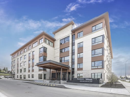 a rendering of the exterior of a building with a street in front of it