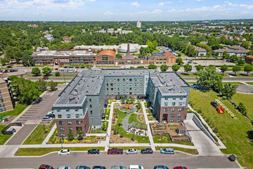 an aerial view of a building in the middle of a parking lot
