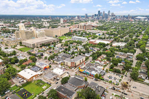 an aerial view of the city with the skyline in the background