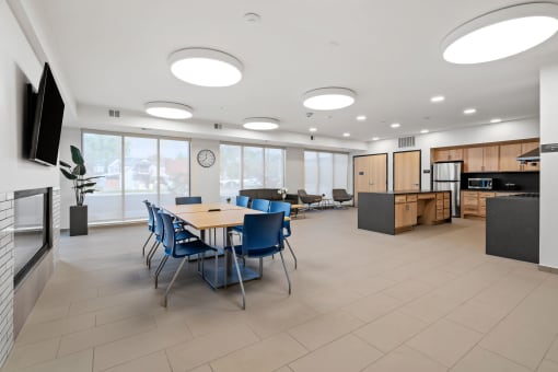 a dining room with tables and chairs in a large room with a ceiling full of