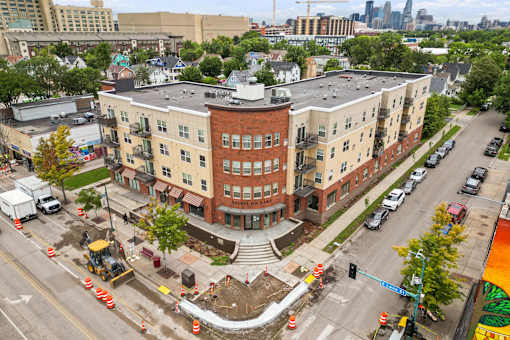 an aerial view of a building in the middle of an intersection