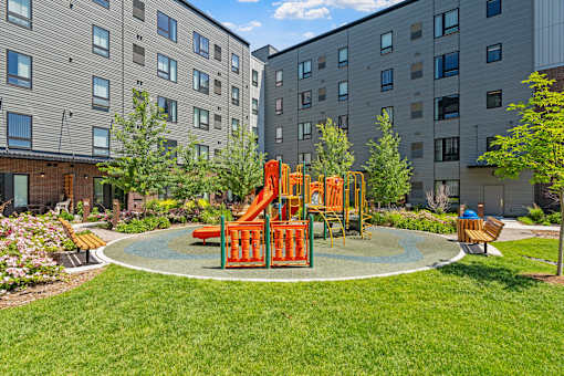 a playground in the middle of an apartment complex