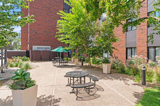 our apartments offer a courtyard with tables and chairs