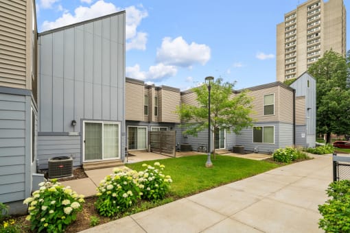 our apartments have a spacious courtyard with green grass and flowers