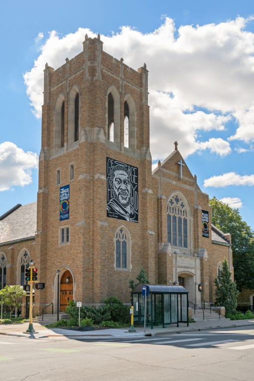 an old church with a mural on the side of it
