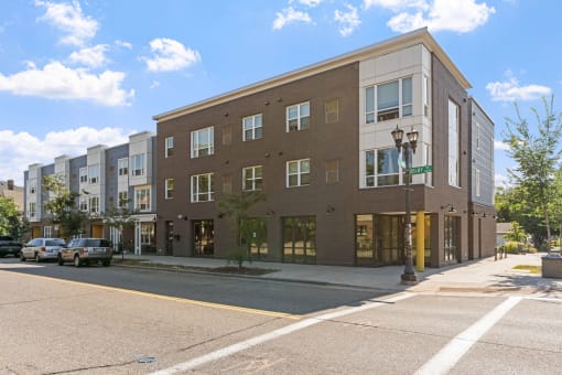 a brick building on the corner of a city street