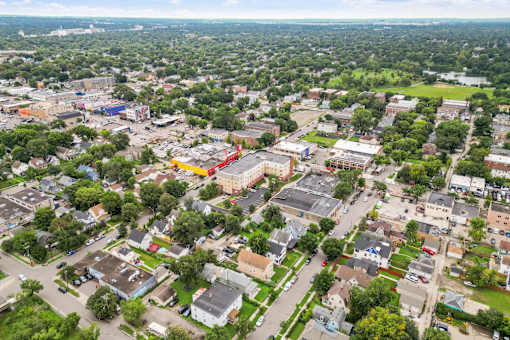 an aerial view of a city with buildings and trees
