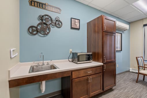 a kitchen with a sink and a microwave