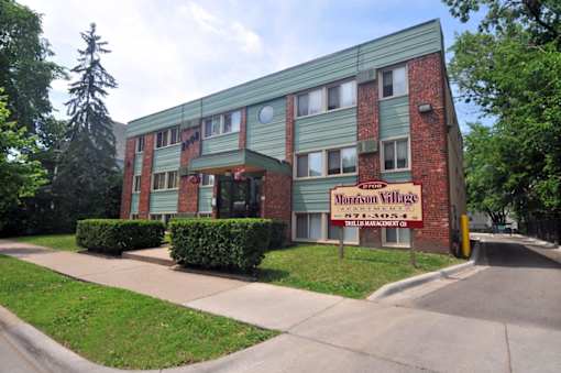 A building with a sign that says Morrison Village.