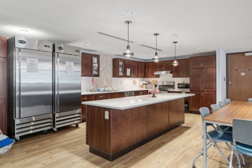 a kitchen with wooden cabinets and stainless steel appliances