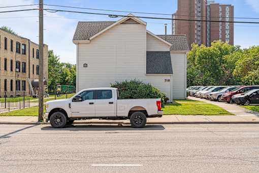 a white truck parked on the street in a parking lot