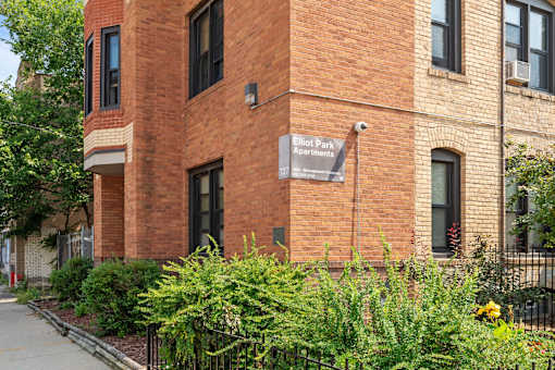 a brick building with a sign on the side of it