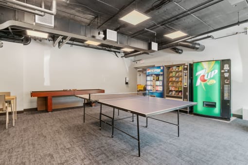 a room with a ping pong table and a pool table