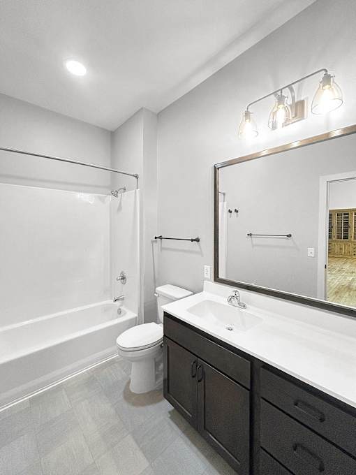 a bathroom with a sink toilet and a shower