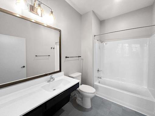 a bathroom with a sink toilet and a shower