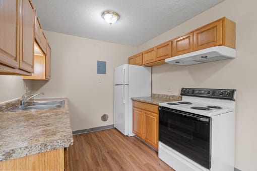 a kitchen with a stove oven and a refrigerator