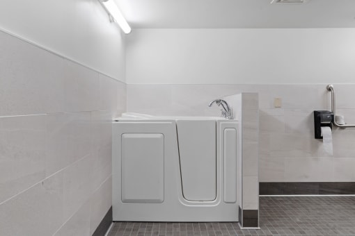 a bathroom with a washer and dryer in it