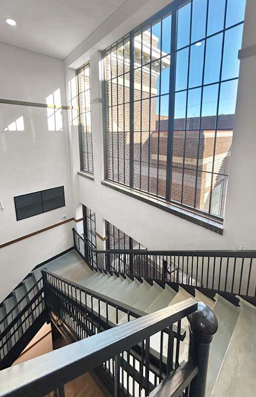 a view of a building from the top of a staircase