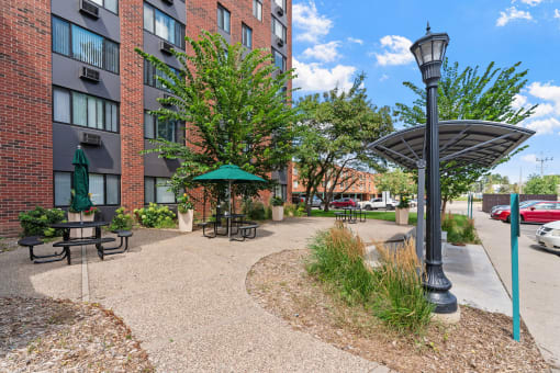 our apartments offer a spacious courtyard with picnic tables and umbrellas