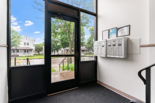 the entrance to a office with a door and a window