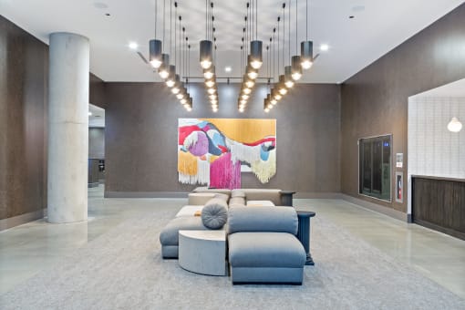 a rendering of a lobby with a large colorful painting on the wall