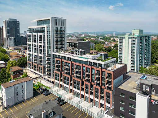 an aerial view of a large building in a city with tall buildings