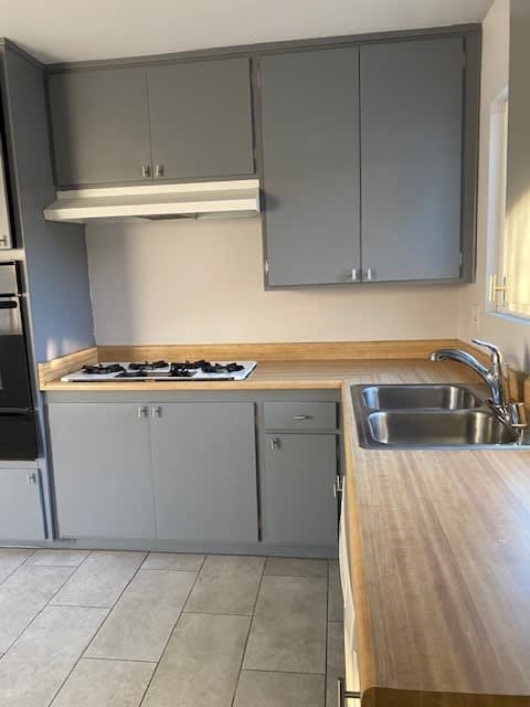 a kitchen with a stove and a sink