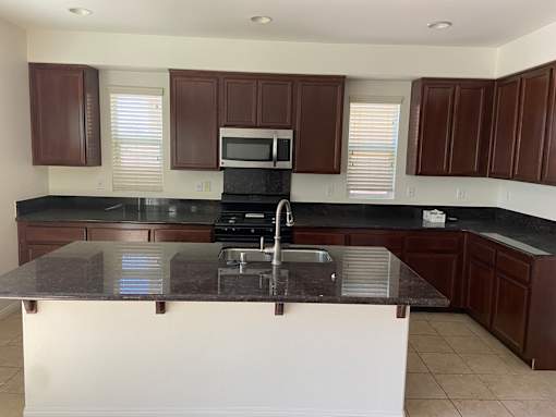 a kitchen with a counter top and a sink
