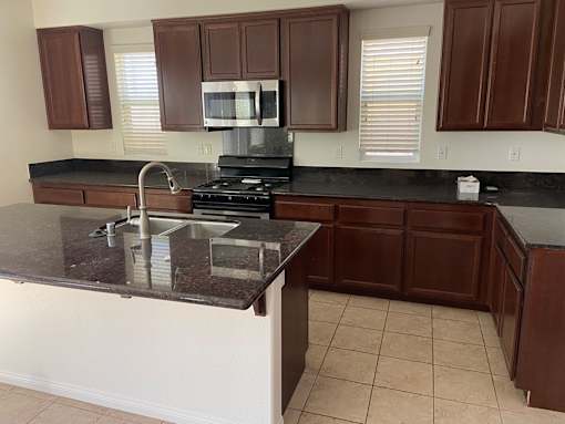 a kitchen with a counter top and a sink